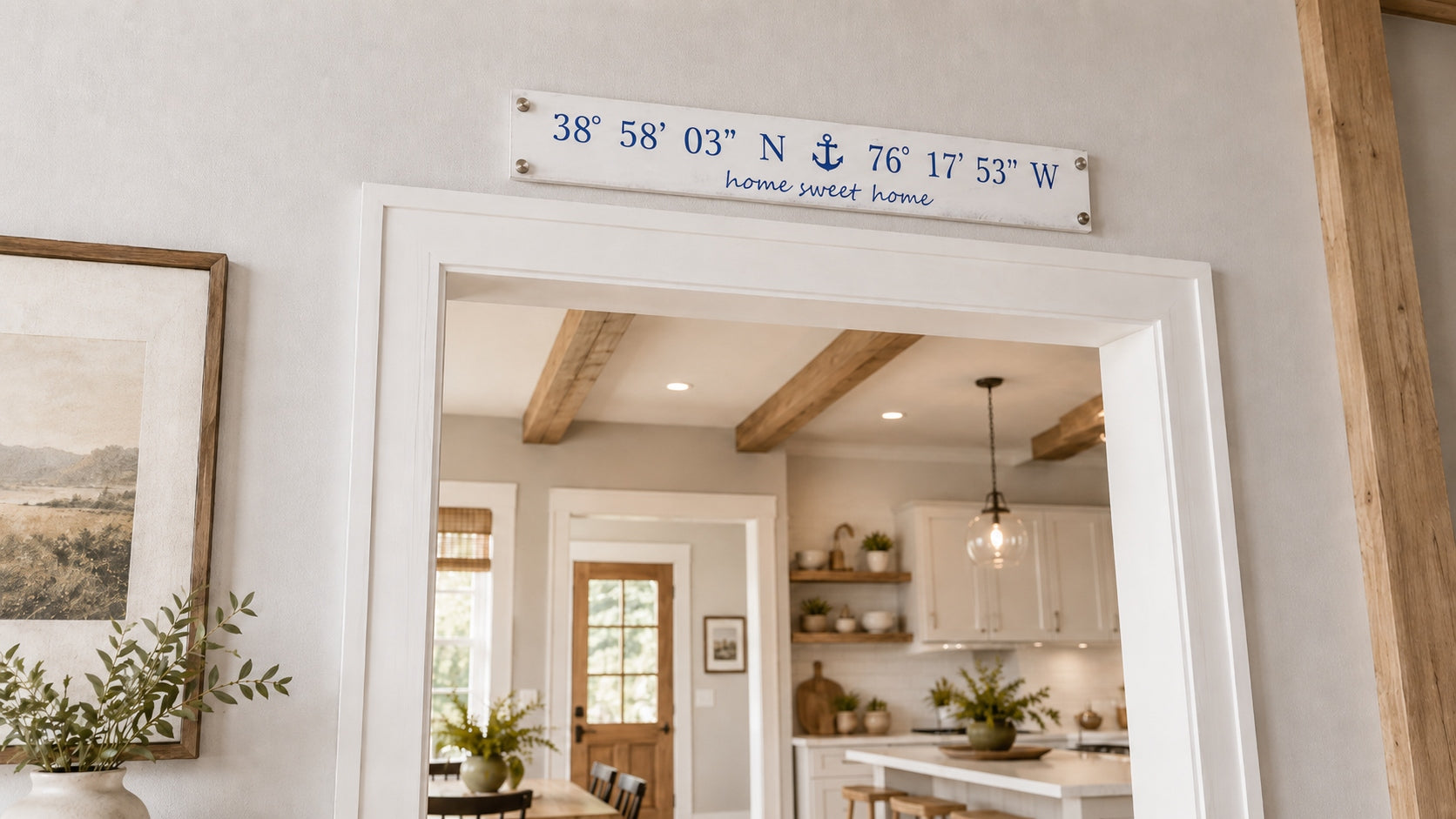 A 30″ × 4.5″ Coordinate Board hanging on a wide wall above a linen sofa in a family room — home sweet home at the bottom.